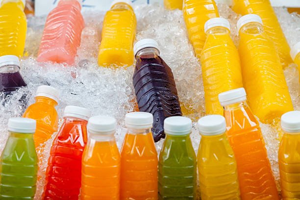 fruit juice bottles in ice.